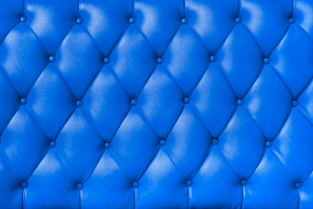 background image of plush blue leather stock photo