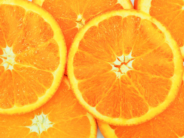 istock Slices of fresh orange texture background. 939951476