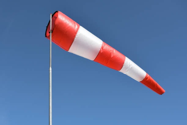 Wind cone against blue sky Wind cone against blue sky. Windsock in windless and perfect flying weather weather vain stock pictures, royalty-free photos & images