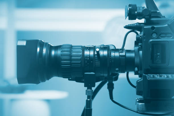 istock Professional video camera lens, recording TV show in studio 939956530