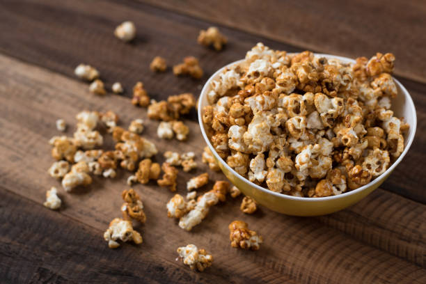 istock caramel popcorn on wooden table background 939957000