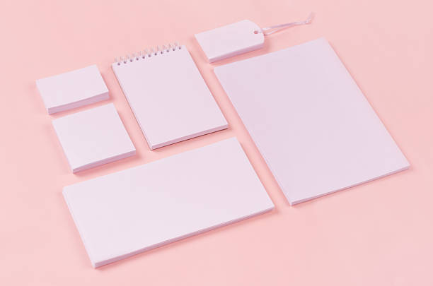 istock Corporate identity template with white stationery set on soft pastel pink background, inclined. Mock up for branding, business presentations and portfolios. 939957940
