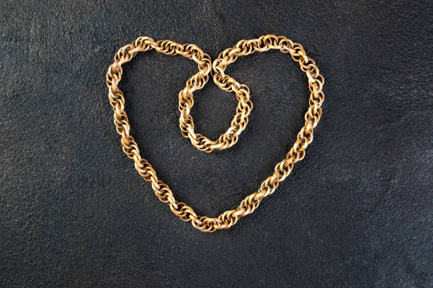 istock Vintage wooden necklace on black background 939957966