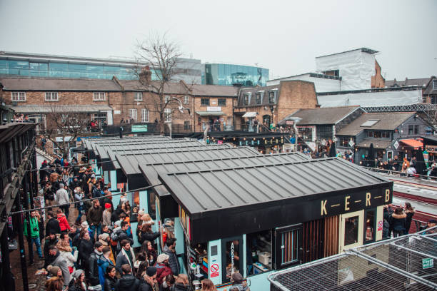 Camden Food Market London, England - 03 March, 2018: A large amount of people gathering at Camden Food Market in London. camden market stock pictures, royalty-free photos & images