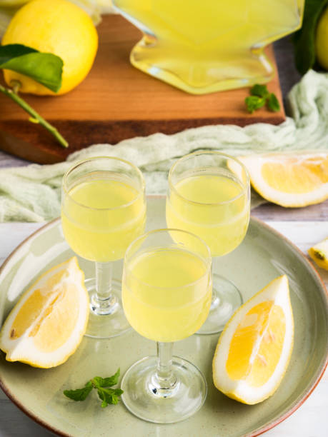 istock Home made limoncello in stemmed glasses 939961028
