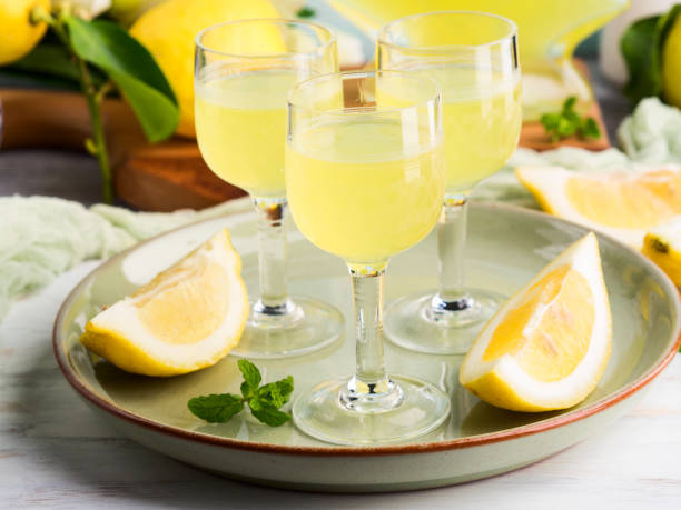 istock Home made limoncello in stemmed glasses 939961274