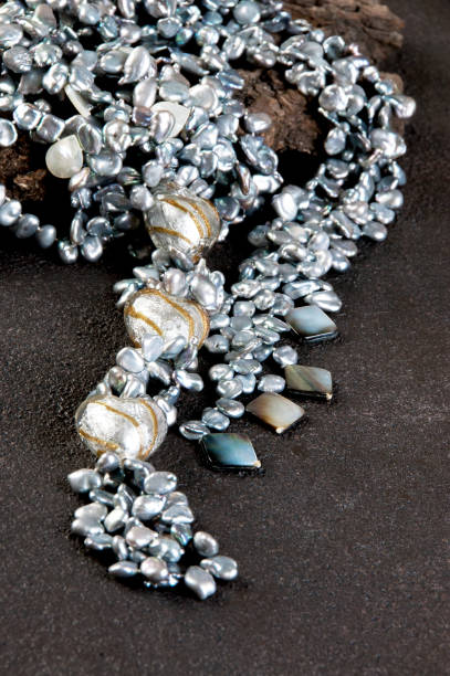 istock Vintage pearl necklace on black background 939961294