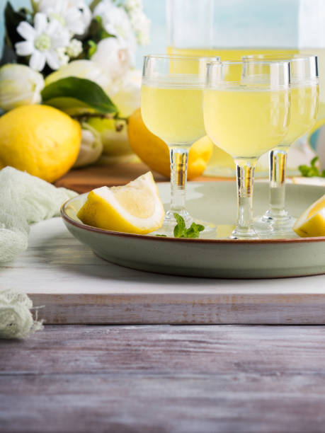istock Home made limoncello in stemmed glasses 939961332