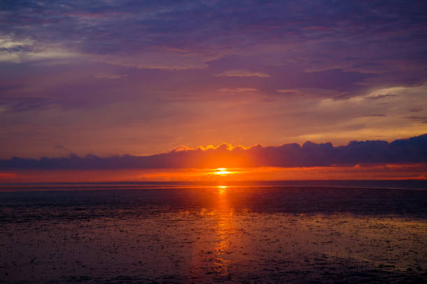 wonderful dark silver and orange sea with sunset twilight sky in the evening time. - 5891 imagens e fotografias de stock