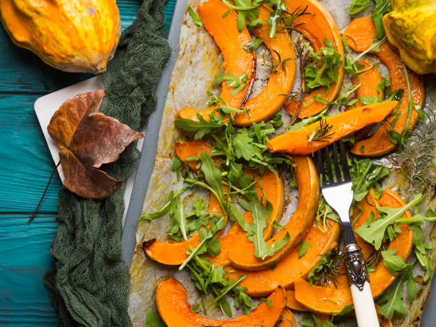 istock Baked pumpkin slices on tray 939963208