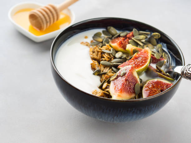 istock Healthy breakfast yogurt bowl with granola and fig 939963346