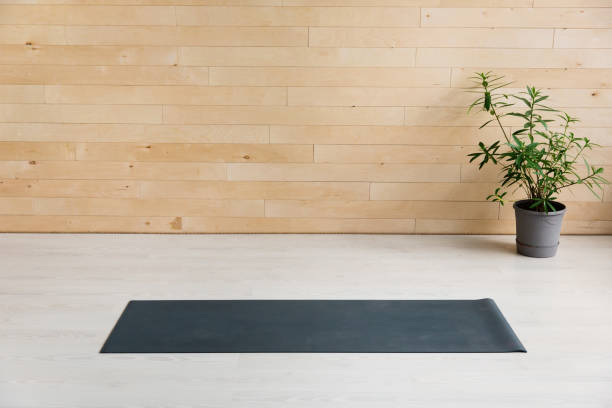 istock Gym with yoga mat interior 939963366