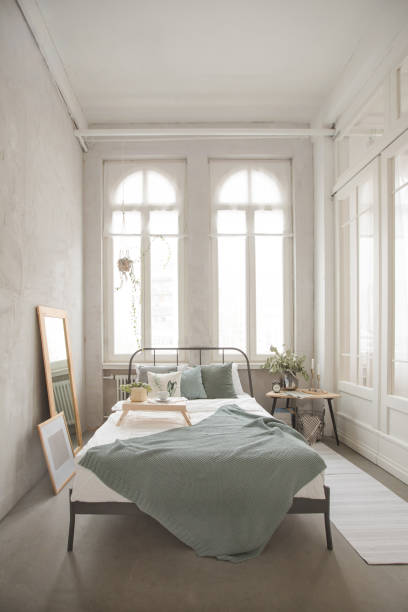 istock Interior of white and gray cozy bedroom 939963406