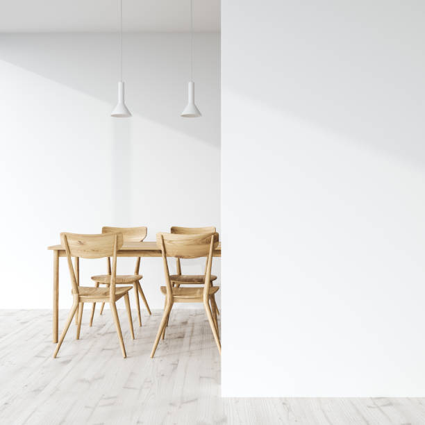 istock Wooden dining table in a white room, wall 939967522