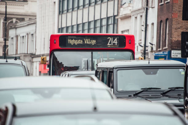 istock Red bus in the middle of a traffic jam 939971580