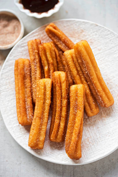 istock Churros with cinnamon sugar and chocolate sauce 939971664