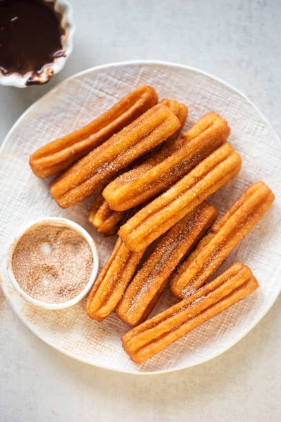 istock Churros with cinnamon sugar and chocolate sauce 939973966