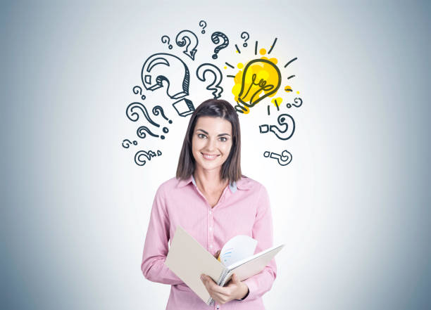 istock Smiling young woman, copybook, answer 939974050