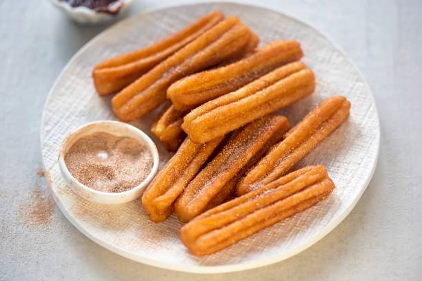 istock Churros with cinnamon sugar and chocolate sauce 939974146