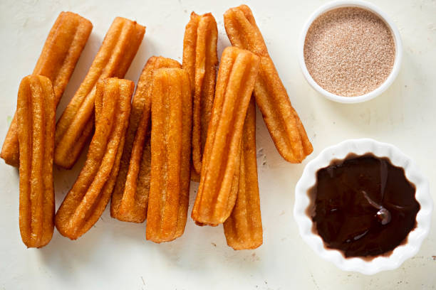 istock Churros with cinnamon sugar and chocolate sauce 939974210