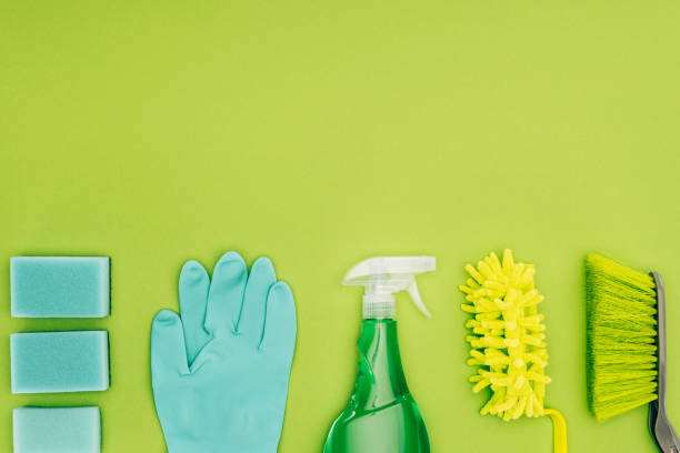 istock top view of rubber glove and spray bottle isolated on light green 939974232