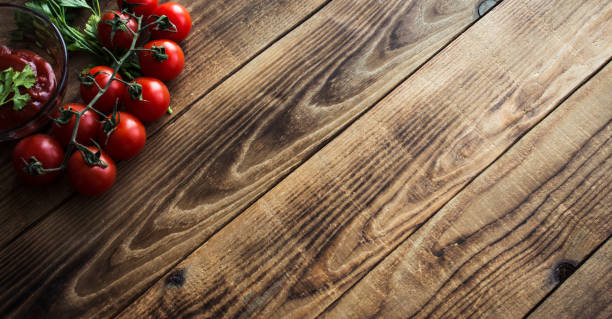 istock tomatoes with greens and sauce on wooden background 939977232