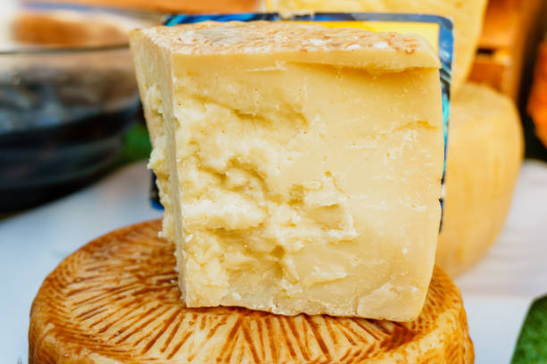 istock broken-off piece of cheese on the market 939978184