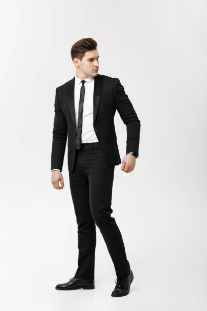 istock Full length Portrait Businessman posing stylishly on white background. 939981902