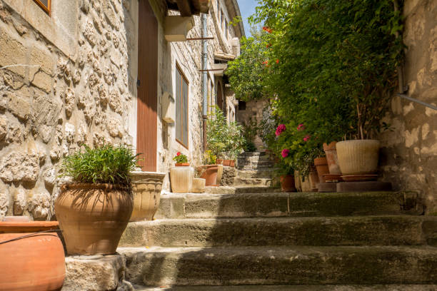 Street in medieval village of les Baux. Les Baux is now given over entirely to the tourist trade, relying on a reputation as one of the most picturesque villages in France stock photo
