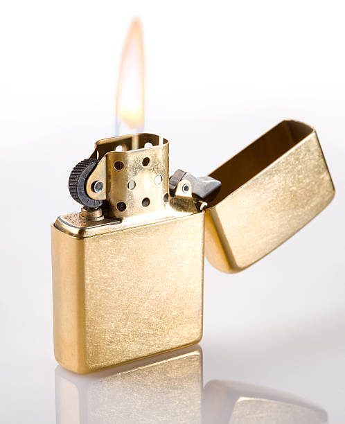 istock Flaming golden lighter on a white background 94000478