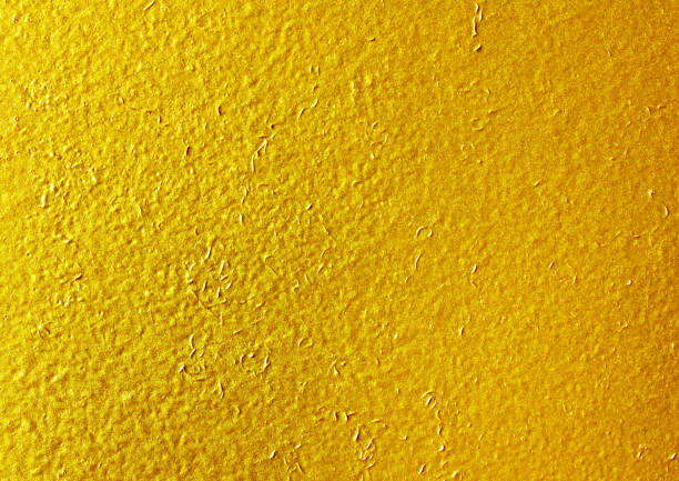 istock Shiny yellow leaf gold foil texture background. 940011410