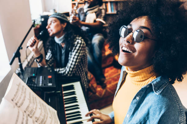 istock African woman singing with a band 940031470