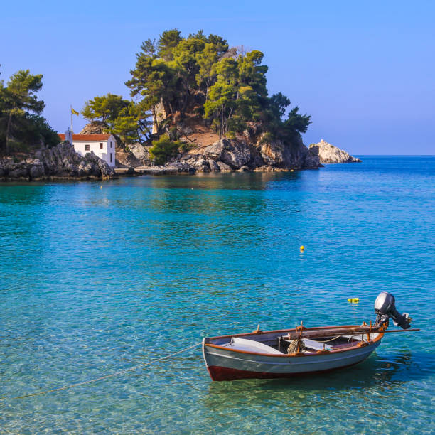 Parga Boat and island in Parga in Epirus, Greece. parga greece stock pictures, royalty-free photos & images