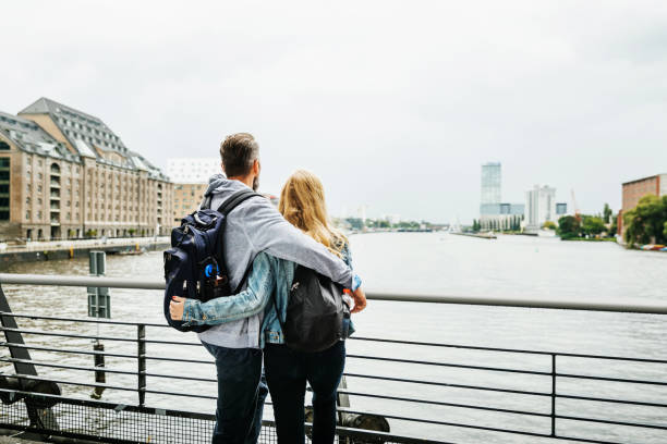 istock Tourist Couple Taking In River View 940034224