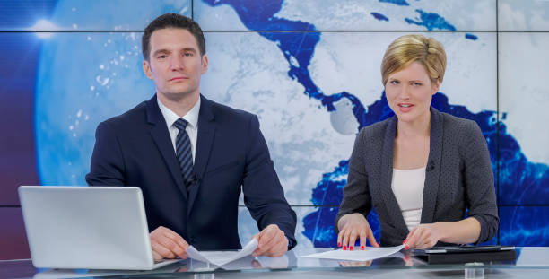 istock Newsreaders in television studio 940035150