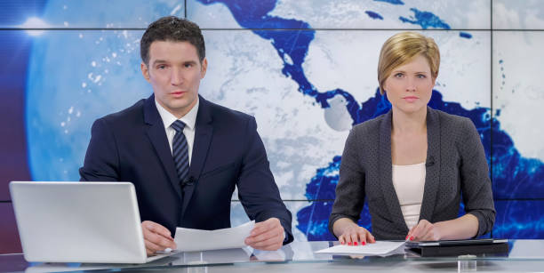 istock Newsreaders in television studio 940035154