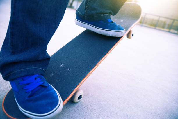 istock skateboarder legs skateboarding at skate park 940035252