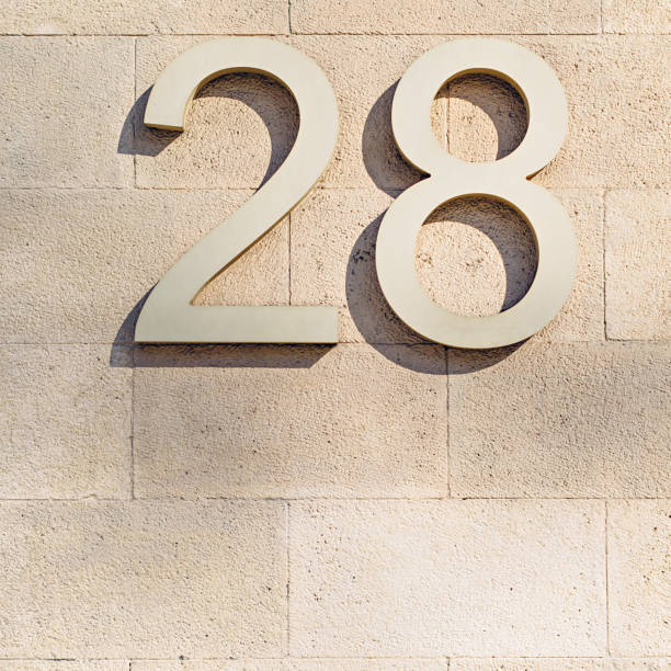 istock 2 and 8 digits on a stone tile wall. Barcelona, Spain. 940037866