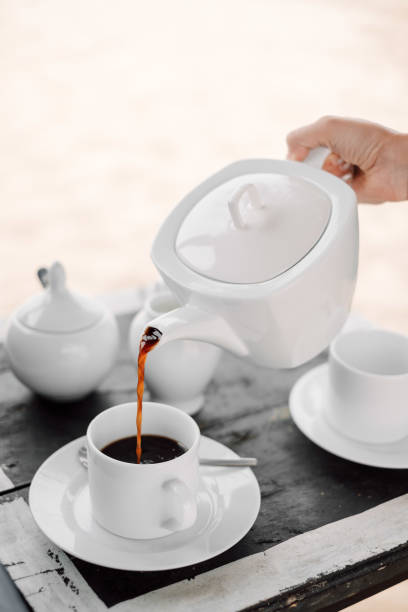 istock Pot of coffee and cups 940038336
