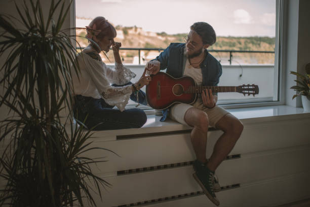 istock Romantic date with girl and guitar 940049744