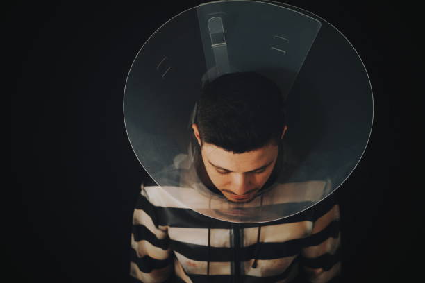 istock Man In Glass Against Black Background 940054064