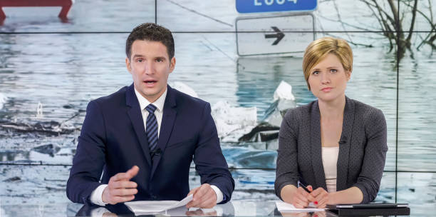 istock Newsreaders in television studio 940054650