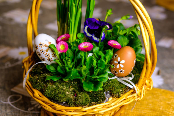 istock Beautiful easter basket with plants, grass and eggs 940054756