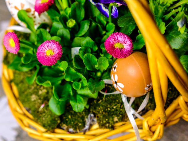 istock Beautiful easter basket with plants, grass and eggs 940054906