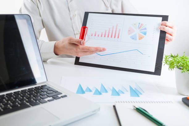 istock Business financier audit working with laptop and data annual report. 940057384