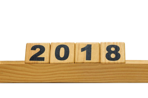 istock New Year 2019 and Old 2018 with wood block isolated 940061874