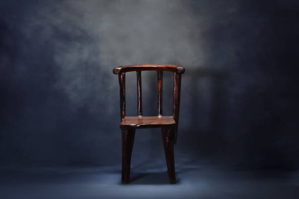 istock Old wooden chair on dark scene 940078736
