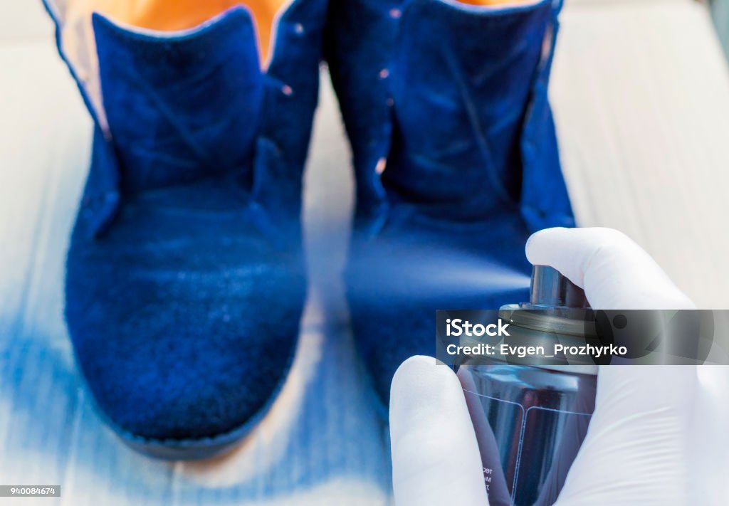 Shoe Care The Person In The White Rubber Gloves Paints With