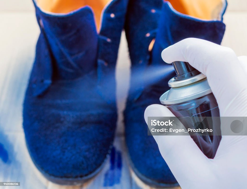 Shoe Care The Person In The White Rubber Gloves Paints With
