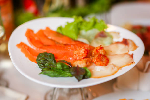 Seafood plate - salty red and white fish with shrimp and herbs